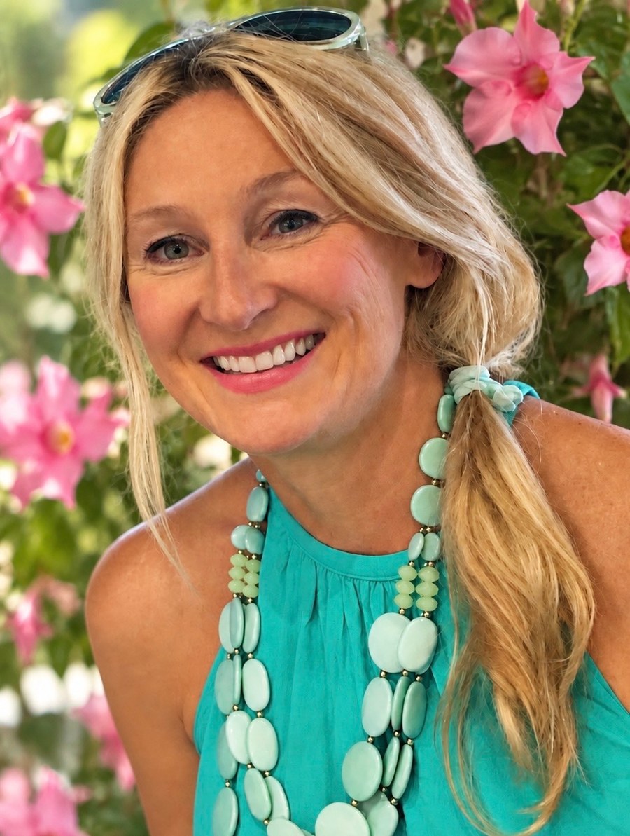 Lisa Renee Deutz, smiling, wearing turquoise